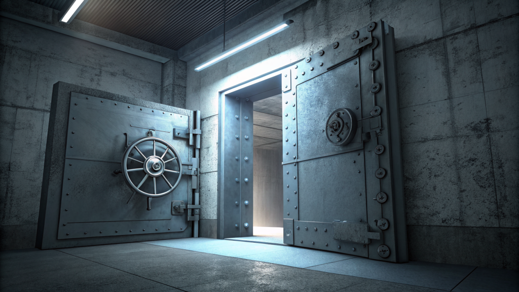A vault door ajar, light leaking from behind
